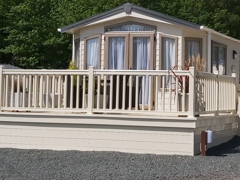 Europa Mulberry static caravan shown with decking and balastrade.