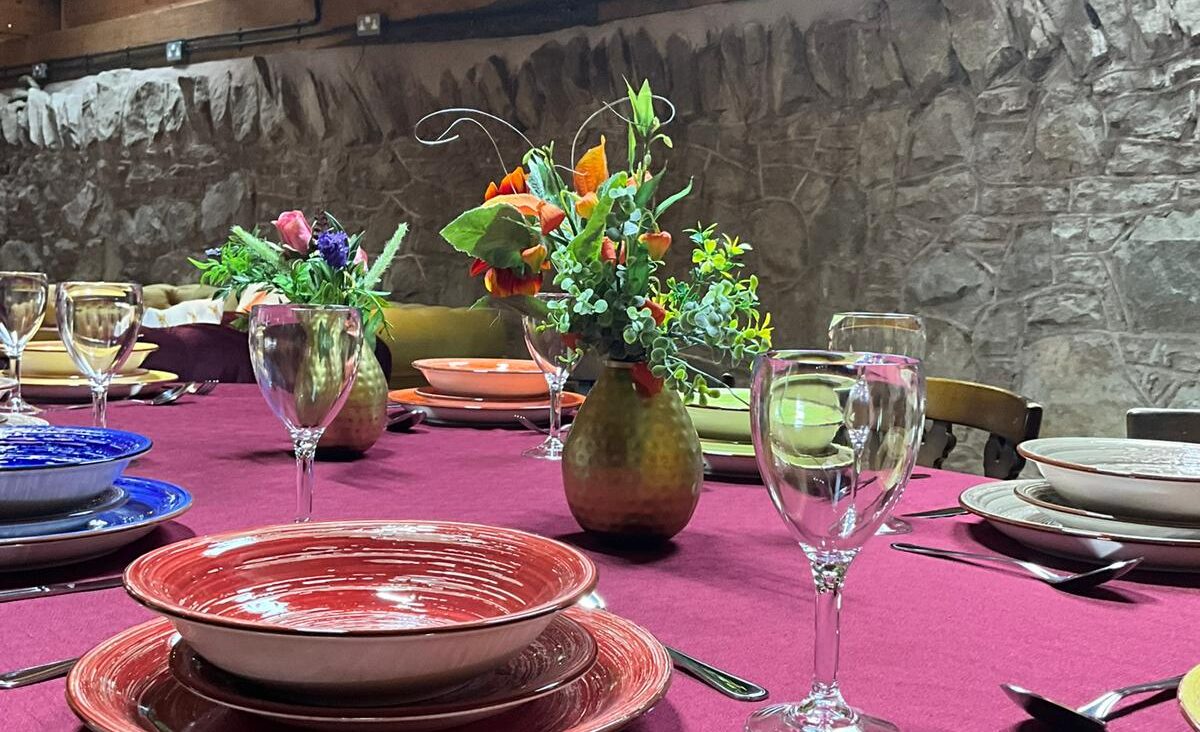 The glamping lodge table set for dinner.