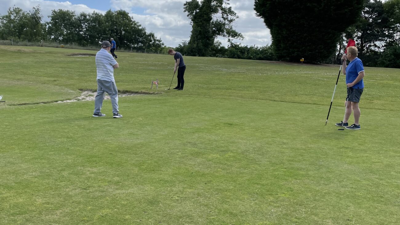 3 Men playing pitch and putt golf at Bank Farm Holiday Park