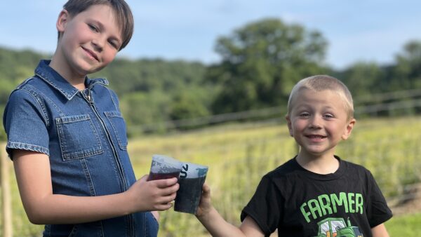 kids at bank farm kids enjoying a cold drink in the summer heat at bank farm holiday park