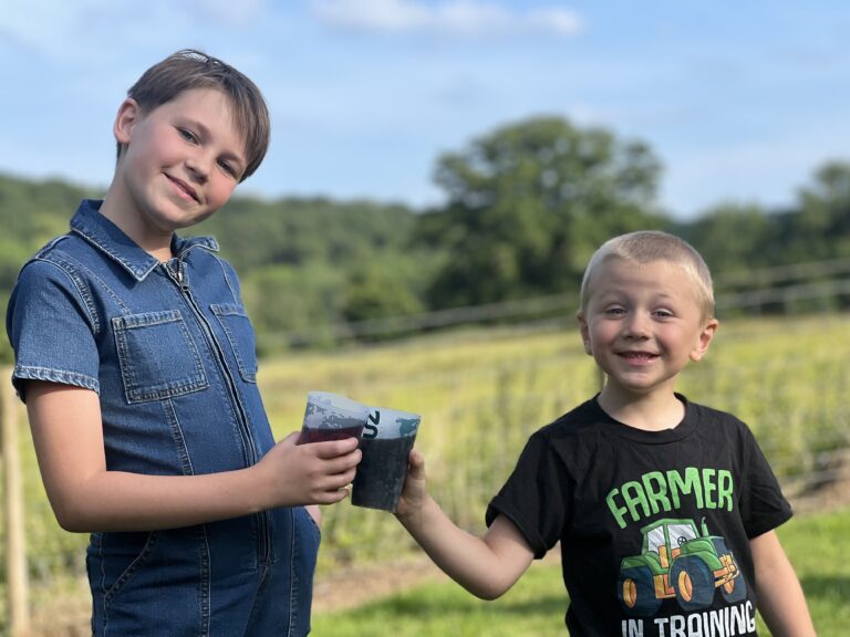 kids enjoying a cold drink in the summer heat at bank farm holiday park